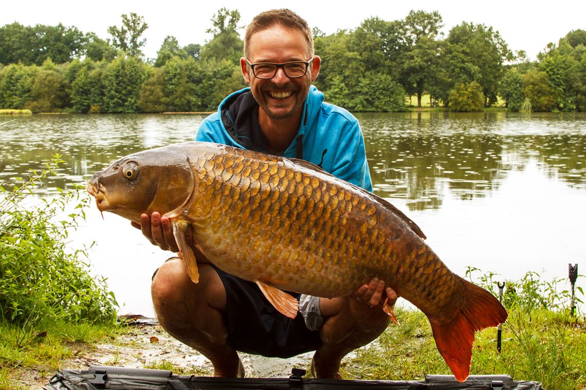 Jake Williamson with a 33lb Common Carp caught from Cherpont Lake in France